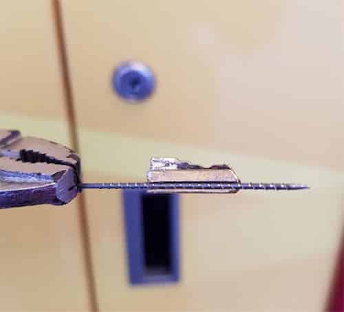image of a broken key on the drill bit that was used to extract it from the lock it broke off in